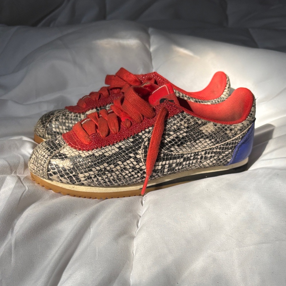 Stylish Kids' Snake Print Sneakers with Red Accents